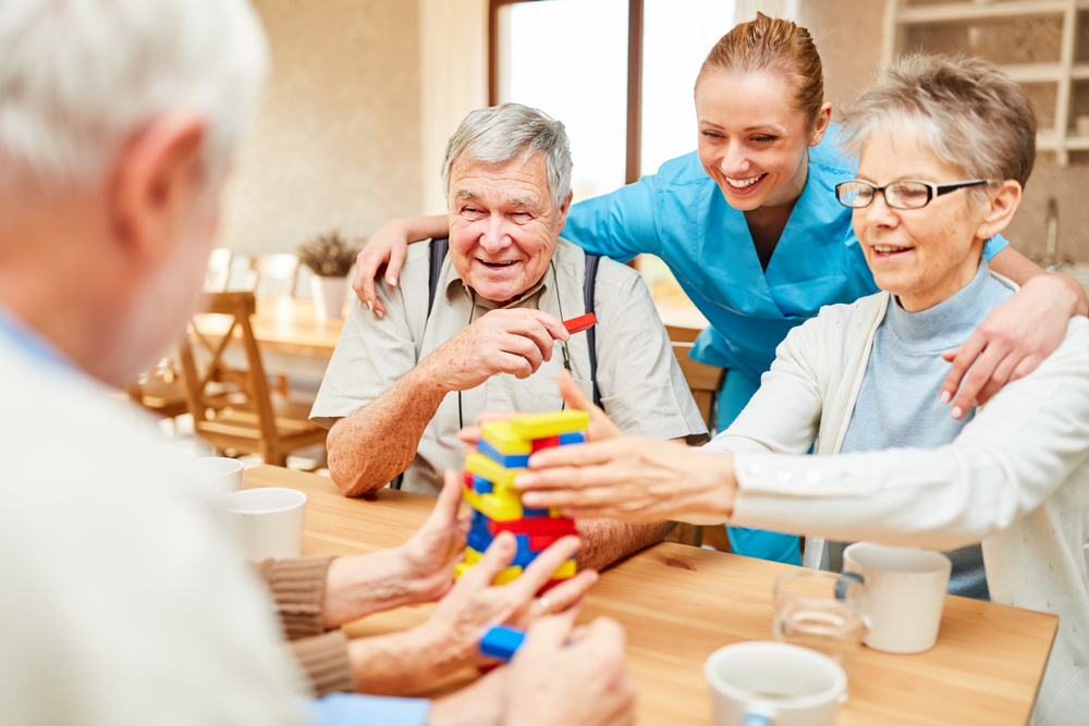 Nursing,Home,Care,In,Demente,Seniors,While,Playing,With,Building